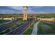 Inviting community entrance with clock tower and landscaping welcoming residents and visitors at 3325 N Coolidge Way, Aurora, CO 80019