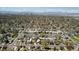 Charming neighborhood offering an aerial view with a beautiful city skyline and distant mountains at 2872 Jasmine St, Denver, CO 80207