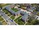A bird's eye view showcases the U-shaped building with lush greenery and parking at 2872 Jasmine St, Denver, CO 80207