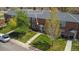 Welcoming two-story brick building with cozy front area seating on a well-manicured lawn at 2872 Jasmine St, Denver, CO 80207