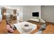 Bright living room with hardwood floors, neutral tones, and ample natural light at 2872 Jasmine St, Denver, CO 80207