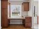 Efficient work nook with cabinets, desk, and window at 2872 Jasmine St, Denver, CO 80207