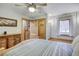 Cozy bedroom with wood accents, dresser, and ceiling fan at 1080 Ski Hill Rd # 9, Breckenridge, CO 80424