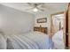 Cozy bedroom with wood accents, dresser, and ceiling fan at 1080 Ski Hill Rd # 9, Breckenridge, CO 80424