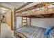 Unique bunk beds made of logs and adjacent hallway at 1080 Ski Hill Rd # 9, Breckenridge, CO 80424