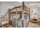 Bedroom features a bunk bed with a wooden frame, side table, and chair at 1080 Ski Hill Rd # 9, Breckenridge, CO 80424