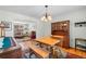 Bright dining room with hardwood floors, wood table and chairs, view to the living room at 3151 E 134Th Cir, Thornton, CO 80241