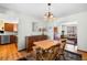 Cozy dining area featuring a wood table set, sideboard, and hardwood floors at 3151 E 134Th Cir, Thornton, CO 80241