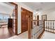 Second story hallway with wood floors, tiled floors and closet at 3151 E 134Th Cir, Thornton, CO 80241