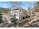 Expansive backyard with mature trees, offering a peaceful and private outdoor space at 30455 Telluride Ln, Evergreen, CO 80439