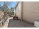 Backyard patio space with seating area and a glimpse of nature's beauty at 30455 Telluride Ln, Evergreen, CO 80439