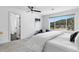 Light and airy bedroom featuring an accent chair, large window, and plush carpet at 30455 Telluride Ln, Evergreen, CO 80439