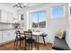 Cozy breakfast nook with built-in seating and a large window view at 30455 Telluride Ln, Evergreen, CO 80439