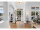 Bright entryway with hardwood floors and a clear view to a treelined yard at 30455 Telluride Ln, Evergreen, CO 80439