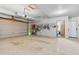 A well-organized garage provides ample space for storage, featuring hooks and racks for equipment at 30455 Telluride Ln, Evergreen, CO 80439