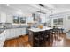 Modern kitchen with stainless steel appliances, island with seating and granite countertops at 30455 Telluride Ln, Evergreen, CO 80439
