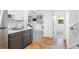 Kitchenette featuring modern cabinets, stainless sink and an open view of the recreation room at 30455 Telluride Ln, Evergreen, CO 80439