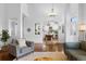 Open concept floorplan featuring hardwood floors, a comfortable sitting area, and views into the dining room at 30455 Telluride Ln, Evergreen, CO 80439
