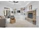 Inviting living room features a fireplace, custom built-ins and walk-out to the balcony at 30455 Telluride Ln, Evergreen, CO 80439