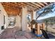 Charming stone patio features a delightful playhouse and ample space for outdoor enjoyment at 30455 Telluride Ln, Evergreen, CO 80439