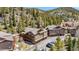 Beautiful aerial view of condos surrounded by lush trees and mountain views at 283 Pelican Cir # 1703, Breckenridge, CO 80424