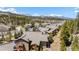 Stunning aerial view of condos surrounded by lush trees and majestic mountain views at 283 Pelican Cir # 1703, Breckenridge, CO 80424