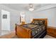 Bedroom featuring a decorative wooden bedframe, bedside table, and light carpeting at 283 Pelican Cir # 1703, Breckenridge, CO 80424