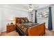 Cozy bedroom with detailed wood furnishings and a large window letting in light at 283 Pelican Cir # 1703, Breckenridge, CO 80424
