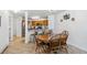 Open dining area with a wooden table and bar seating, connected to the kitchen at 283 Pelican Cir # 1703, Breckenridge, CO 80424