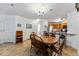 Charming dining area with a wooden table and chairs, next to kitchen and living area at 283 Pelican Cir # 1703, Breckenridge, CO 80424