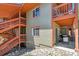Exterior view of a condo building featuring private patios with outdoor seating on each level at 283 Pelican Cir # 1703, Breckenridge, CO 80424