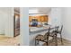 Kitchen view featuring bar seating with stainless steel appliances and tiled flooring at 283 Pelican Cir # 1703, Breckenridge, CO 80424