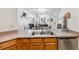 Open concept kitchen with stainless steel appliances and breakfast bar overlooking living area at 283 Pelican Cir # 1703, Breckenridge, CO 80424