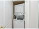 A laundry area with a stacked washer and dryer unit inside a white closet at 283 Pelican Cir # 1703, Breckenridge, CO 80424