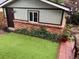 Backyard with artificial turf and beautiful ivy-covered brick wall at 821 S High St, Denver, CO 80209