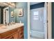 Bathroom with vanity and tub/shower combo at 821 S High St, Denver, CO 80209