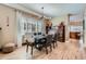 Elegant dining area with wood floors, stylish light fixture, and large window at 821 S High St, Denver, CO 80209