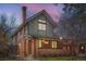 Beautiful two-story home with a brick facade, covered porch, and mature landscaping, perfect for families at 821 S High St, Denver, CO 80209
