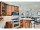 Well-lit kitchen features stainless appliances and an island adjacent to the living room at 821 S High St, Denver, CO 80209