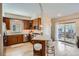 Bright kitchen with wood cabinets, stainless steel appliances, and an island with seating at 821 S High St, Denver, CO 80209