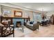Bright living room showcasing wood floors, a blue brick fireplace, and comfortable furniture at 821 S High St, Denver, CO 80209
