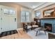 Cozy living room with wood floors, fireplace, comfortable seating, and natural light at 821 S High St, Denver, CO 80209