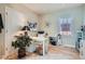 Bright home office featuring wood floors, a desk, and ample storage space at 821 S High St, Denver, CO 80209