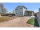 View of the backyard with a wooden fence, patio area and landscaping, perfect for outdoor enjoyment at 1923 Ensenada Ct, Aurora, CO 80011