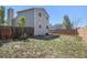 Side and rear view of house, featuring a fenced in yard at 1923 Ensenada Ct, Aurora, CO 80011