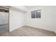 Unfinished basement with a small window and plenty of space at 1923 Ensenada Ct, Aurora, CO 80011