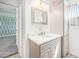 Bathroom featuring a vanity, quartz countertop, with updated fixtures at 1923 Ensenada Ct, Aurora, CO 80011