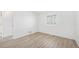 Bright bedroom with wood flooring, window, and neutral color scheme at 1923 Ensenada Ct, Aurora, CO 80011
