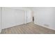 Bright bedroom features hardwood floors and a closet with sliding doors at 1923 Ensenada Ct, Aurora, CO 80011