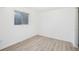 Neutral room with hardwood floors and a window at 1923 Ensenada Ct, Aurora, CO 80011